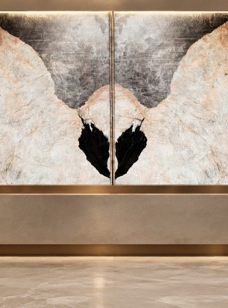 Bookmatched quartzite reception wall